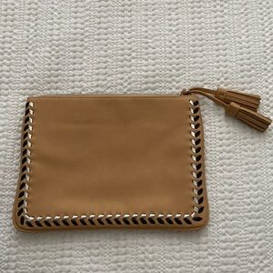 Tan clutch with black and silver detailing